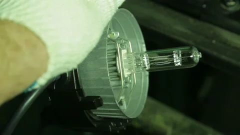 In the hands of the illuminator in gloves, a halogen lamp in the rear of the Stock Footage 103222661