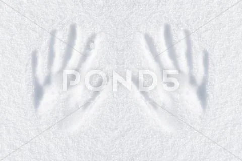 Hands impression in fresh snow Stock Photos