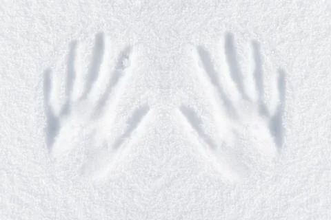 Hands impression in fresh snow Stock Photos