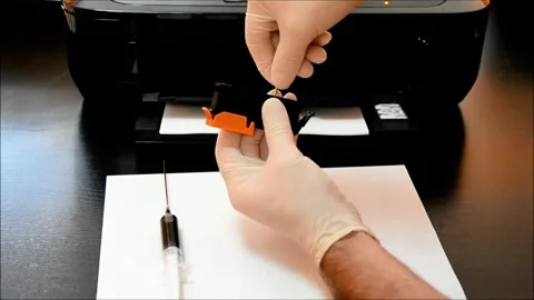 Hands-On Ink Cartridge Refill Tutorial- Save on Printing Costs Video stock 321180679