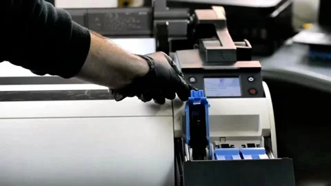 Hands-On Ink Cartridge Setup in Professional Print Environment Stock Footage 320994805