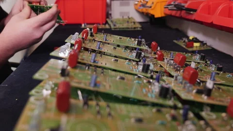 Hands inserting electronic component into printed circuit board Video stock 141208022
