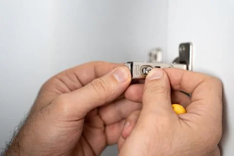 Hands Installing Cabinet Hinge Stock Photos