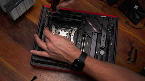 Hands installing CPU cooler on motherboard. Ideal for tech tutorials and Stock Footage 301636119