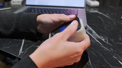 Hands installing soft polyurethane diffuser on LED lamp close-up, attaching Video stock 333649731