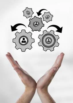 Hands interacting with people in cogs graphics against white background Stock Photos