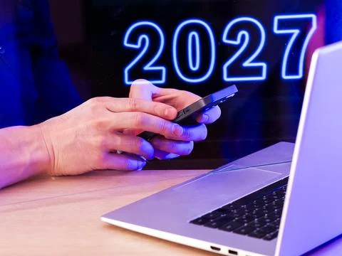 Hands interacting with tech devices against neon backdrop Stock Photos