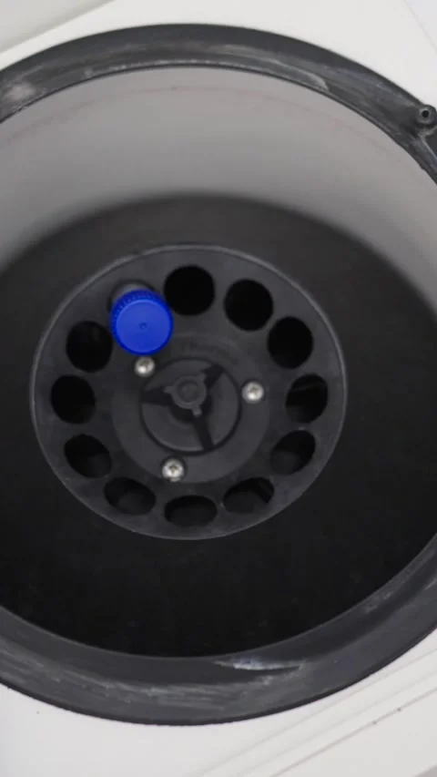 Hands introducing test tubes in centrifuge machine Stock Footage 257721190