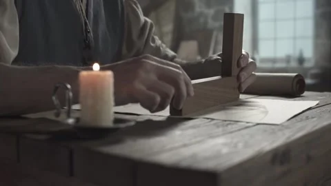 Hands of a inventor checking a flying machine wing blueprint with a wooden tool Stock Footage 340079631
