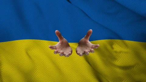Hands invoking on the Ukrainian flag Stock Footage 172109764