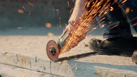 Hands, iron and grinder at construction site to cut material with power tools Stock Footage 336189864