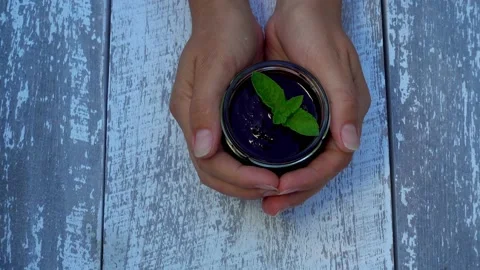 Hands with a jar of berry jam. Stock Footage 157558560
