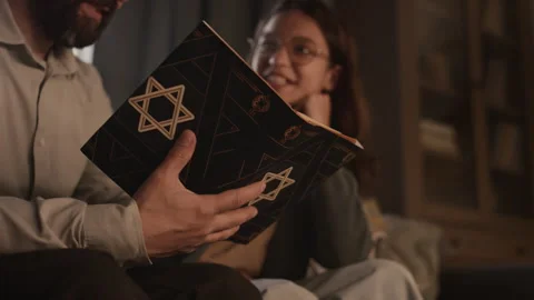 Hands of Jewish Man Studying Torah with Daughter at Home Stock Footage 262829059