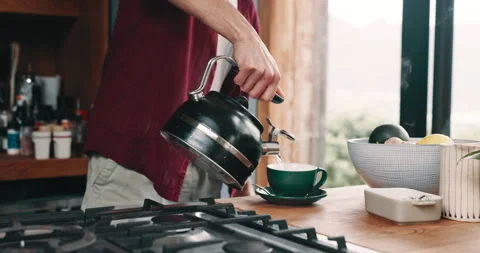 Hands, kettle and person in kitchen with coffee, breakfast and cup on counter in Video stock 319869392