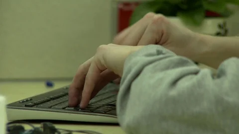 Hands on a keyboard hesitating Stock Footage 77335394