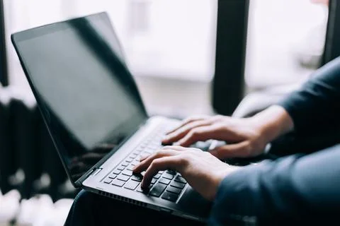 Hands on the keyboard of the laptop type text. Computer work concept. 스톡 사진