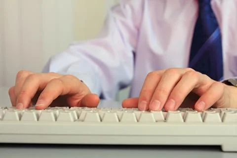 Hands on a keyboard. Stock Photos