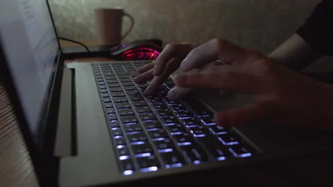 Hands, keyboard, student doing homework at night. Close-up Stock Footage 255562912