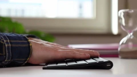 Hands on the keyboard at the table, thinking where to start Video stock 244599164