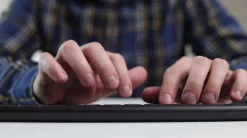 Hands on the keyboard at the table, thinking where to start Stock Footage 244599170