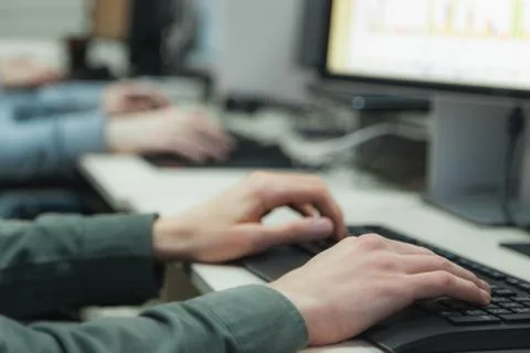 Hands on keyboard of  two typing and coding programmers in the it-office, clo Stock-Fotos