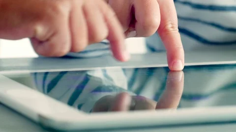 Hands of Kids Playing on Tablet Stock-Footage 101037938