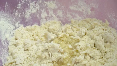 Hands knead dough in flour on table. Close-up view of Baker's hands, Stock Footage 138581566