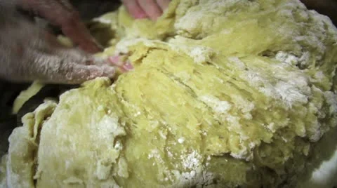Hands knead dough Stock Footage 14808545
