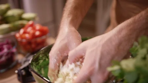 Hands kneading and pounding out dough in a bowl Video stock 124225404