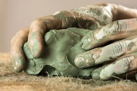 Hands kneading blue clay Stock Photos