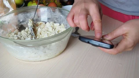 Hands kneading dough in flour, adds egg to flour,  baking powder, sugar Stock Footage 170901293