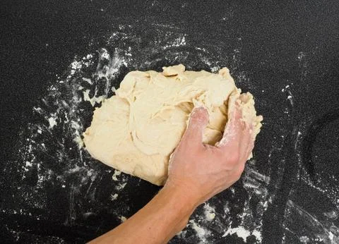 Hands kneading dough Stock-Fotos