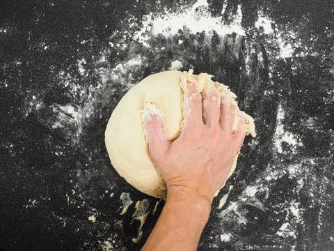 Hands kneading dough Stock Photos