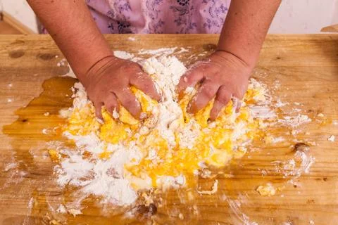 Hands kneading a dough Stock Photos