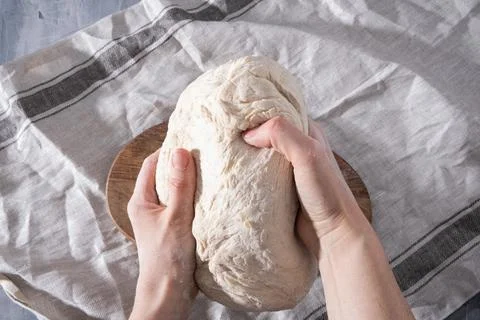 Hands kneading a dough Stock Photos