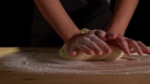 Hands Kneading Dough In Slow Motion Closeup On Black Background Stock Footage 82149743