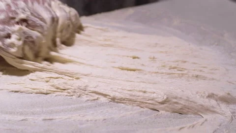 Hands kneading dough on table Stock Footage 132844130