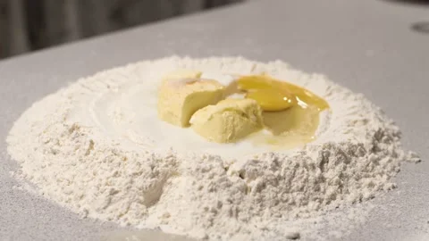 Hands kneading dough on table Video stock 132844132