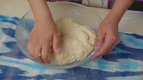 Hands kneading dough on table Stock Footage 317529616
