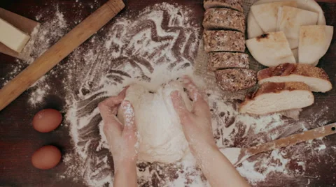 Hands kneading raw dough, slow motion Video stock 62417879