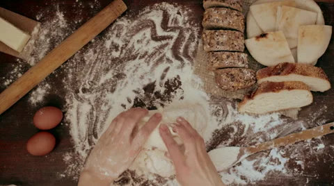 Hands kneading raw dough on the table Stock Footage 62417877