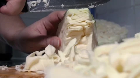 Hands knife cut into cabbage. Stock Footage 97931167