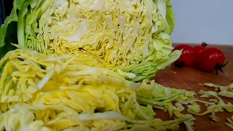 Hands knife cut into cabbage, slow-motion Stock Footage 89765628