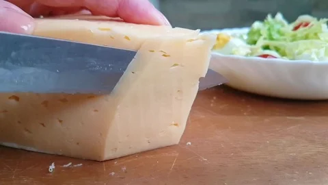Hands knife cut cheese Stock Footage 87945725