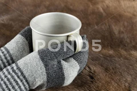 Hands In Knitted Gloves Keep Mug