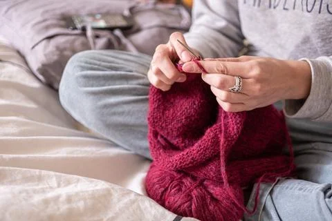Hands knitting sweeter with needles close up Stock Photos