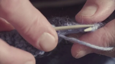 Hands knitting woolen sweater Stock Footage