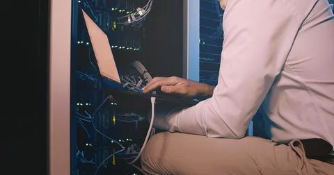 Hands, laptop and cable connection at data center for system test, diagnostics 写真素材