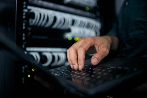 Hands, laptop and typing in server room, man and inspection with coding 스톡 사진