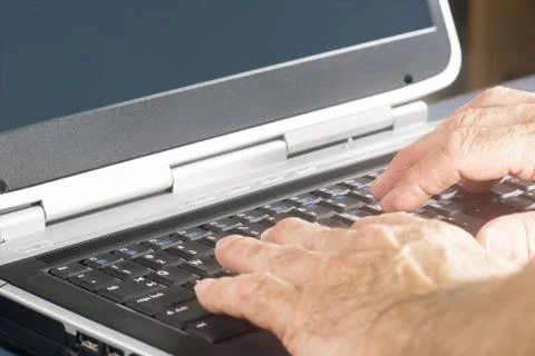 Hands On A Laptop Computer Keyboard Stock Photos
